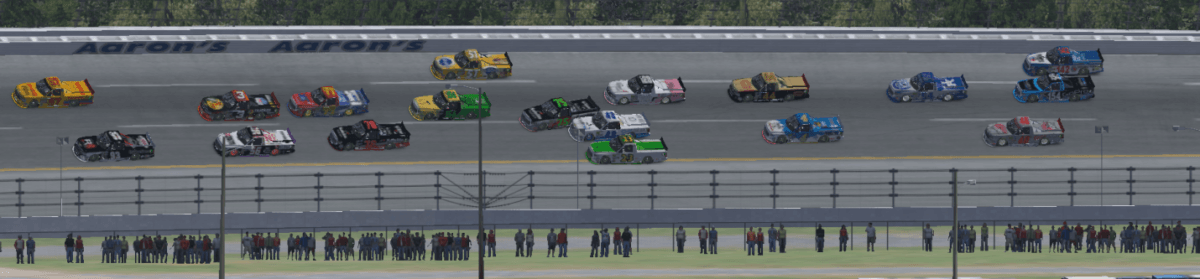 Going into turn 1, 3 wide with 1 lap to go. #42 Ed Adams tries to squeeze it in between #75 Don Phelps and #23 Joshua A Robinson who is straddling the yellow line trying to give room.